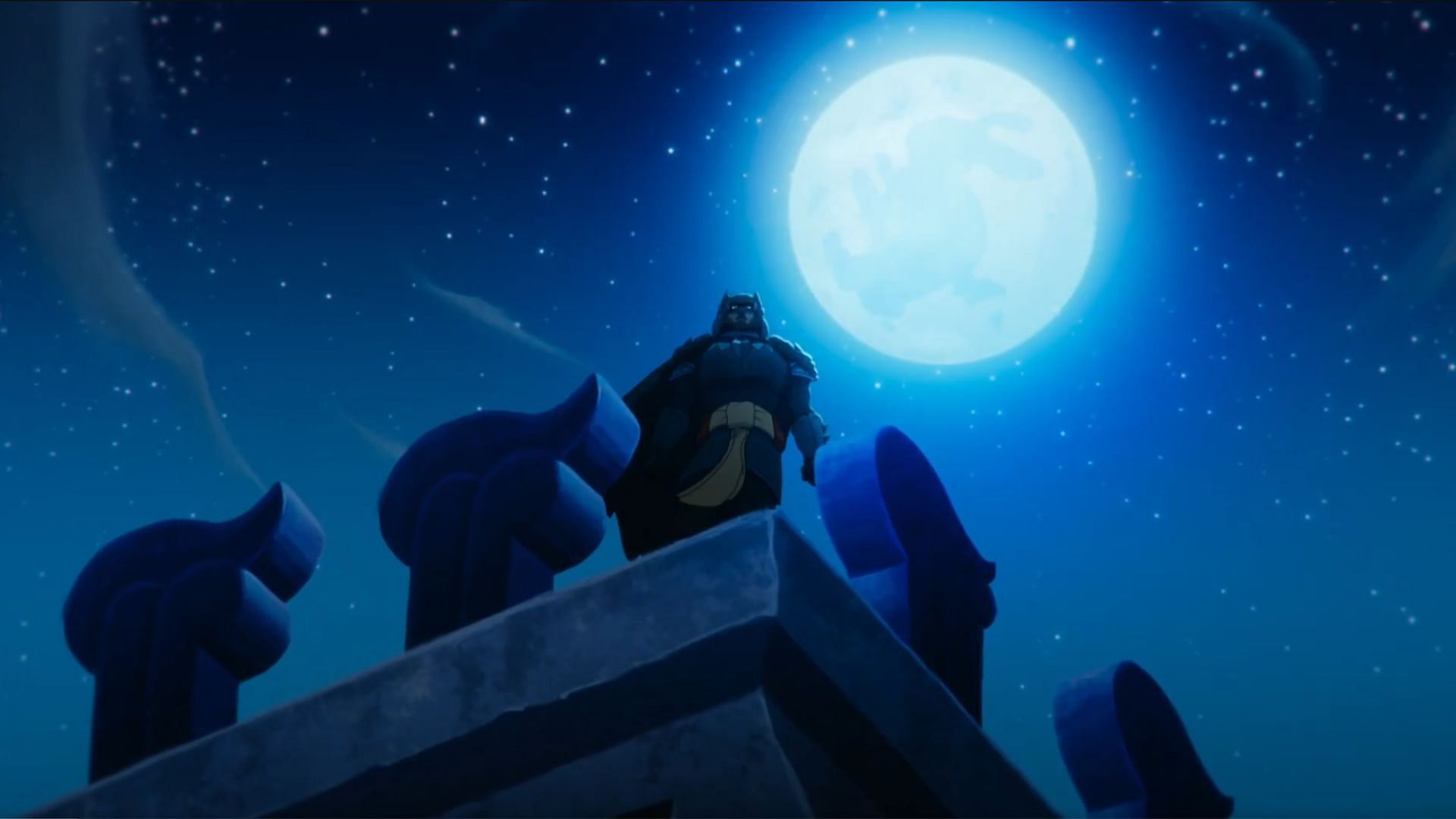 Batman stands vigilant against the night sky under the full moon. (Image via X/WBHomeEnt)