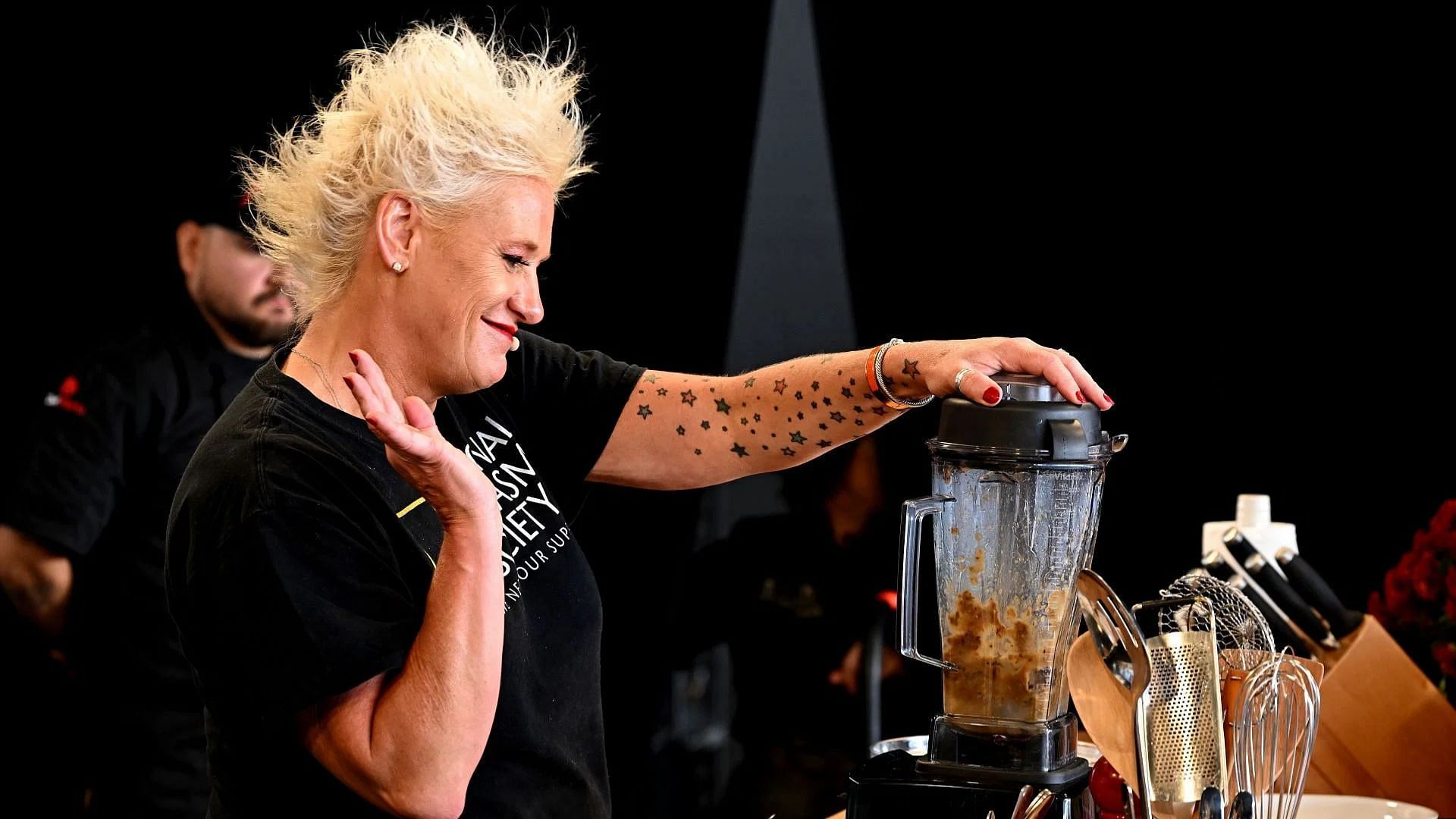 Anne Burrell makes a culinary presentation during the Food Network New York City Wine &amp; Food Festival (Image via Getty)