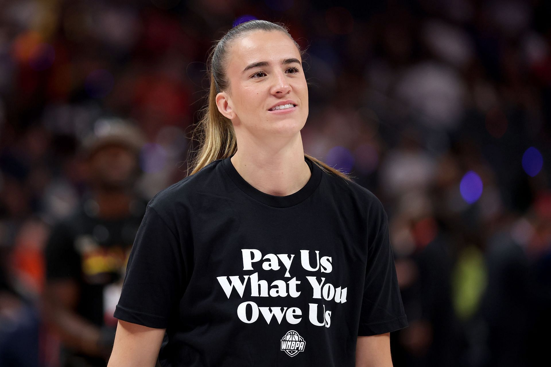 Sabrina Ionescu #20 of the New York Liberty wears a shirt saying &quot;Pay us what you owe us&quot; prior to the 2025 AT&amp;T WNBA All-Star Game at Gainbridge Fieldhouse on July 19, 2025 in Indianapolis, Indiana. - Source: Getty