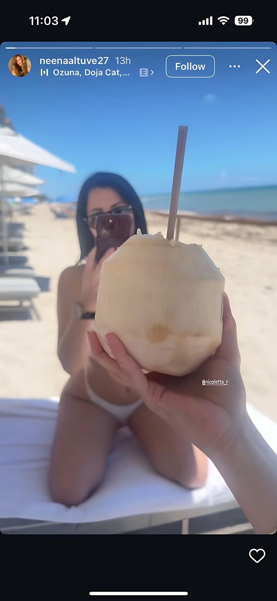 Neena was holding a coconut and creating a boomerang. (via @neenaaltuve27)