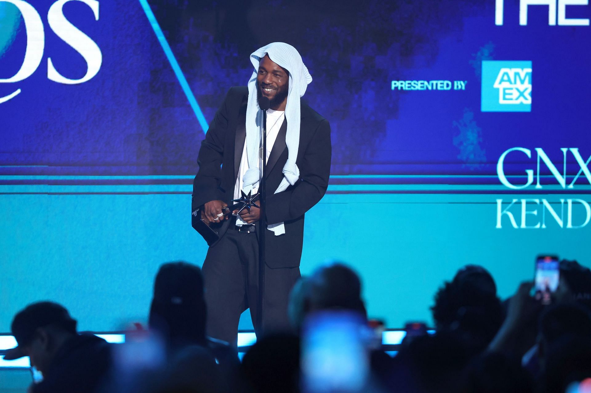 Kendrick Lamar hands the mic to 12-year-old fan after he went bar for bar with the rapper all night during his performance