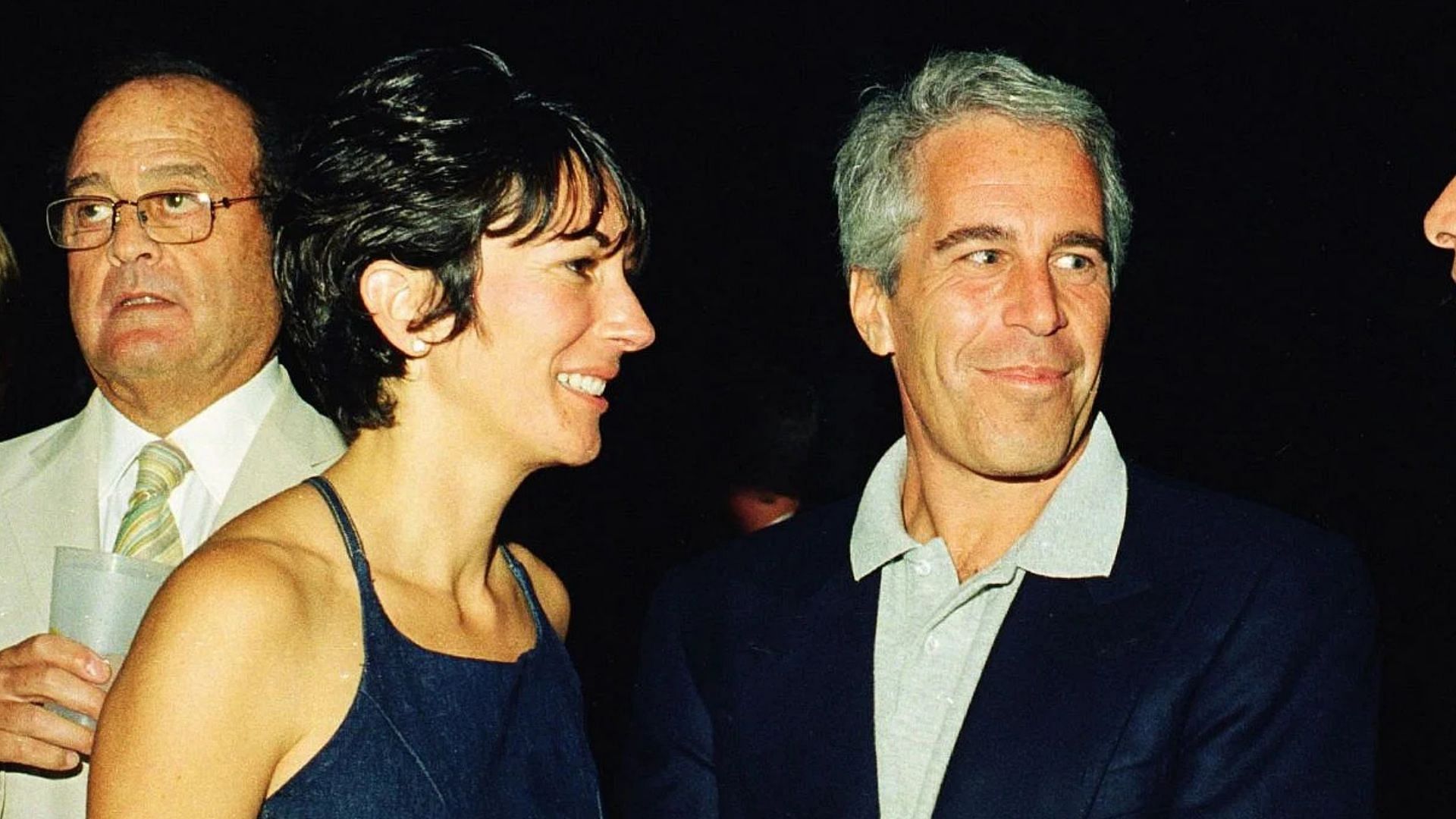 Ghislaine Maxwell, Jeffrey Epstein, and musician Michael Bolton pose for a portrait during a party at the Mar-a-Lago club, Palm Beach, Florida, February 12, 2000 (Image via Getty)