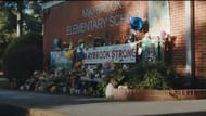 A memorial appears outside Maybrook Elementary School in Weapons 2025, as the community mourns and rallies together after the mysterious disappearance of 17 children. (Image via Warner Bros)