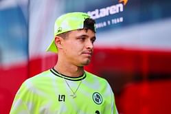 Watch: Lando Norris gets hit on the nose as he is on his way to greet fans