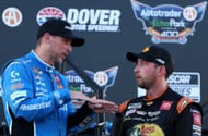 Denny Hamlin (L) speaks to Chase Briscoe after winning the NASCAR Cup Series AutoTrader EchoPark Automotive 400 at Dover Motor Speedway - Source: Getty