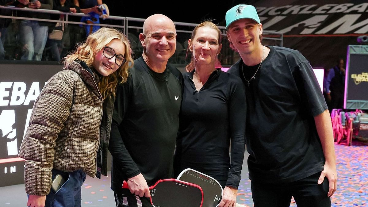 Andre Agassi and Steffi Graf's son Jaden soaks up the sun with girlfriend Catherine as they enjoy outing with pet dog