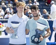 Jannik Sinner (left) and Carlos Alcaraz (right) pose together with their respective men's singles trophies at the 2025 Cincinnati Open (Source: Getty)