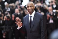 Denzel Washington attends the "Highest 2 Lowest" red carpet at the 78th annual Cannes Film Festival (Image via Getty/Gareth Cattermole)