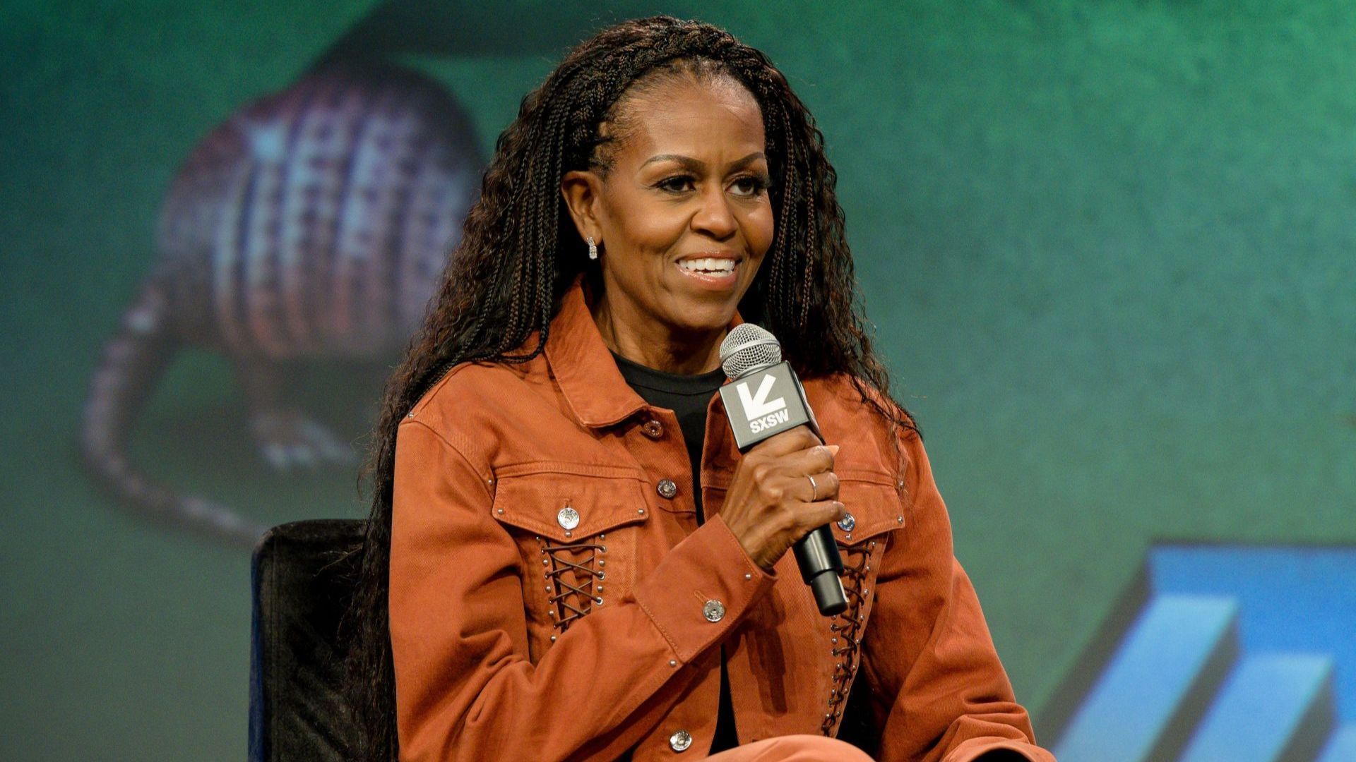 Michelle Obama speaks on stage during IMO Live podcast 2025 SXSW Conference and Festival (Image via Getty)