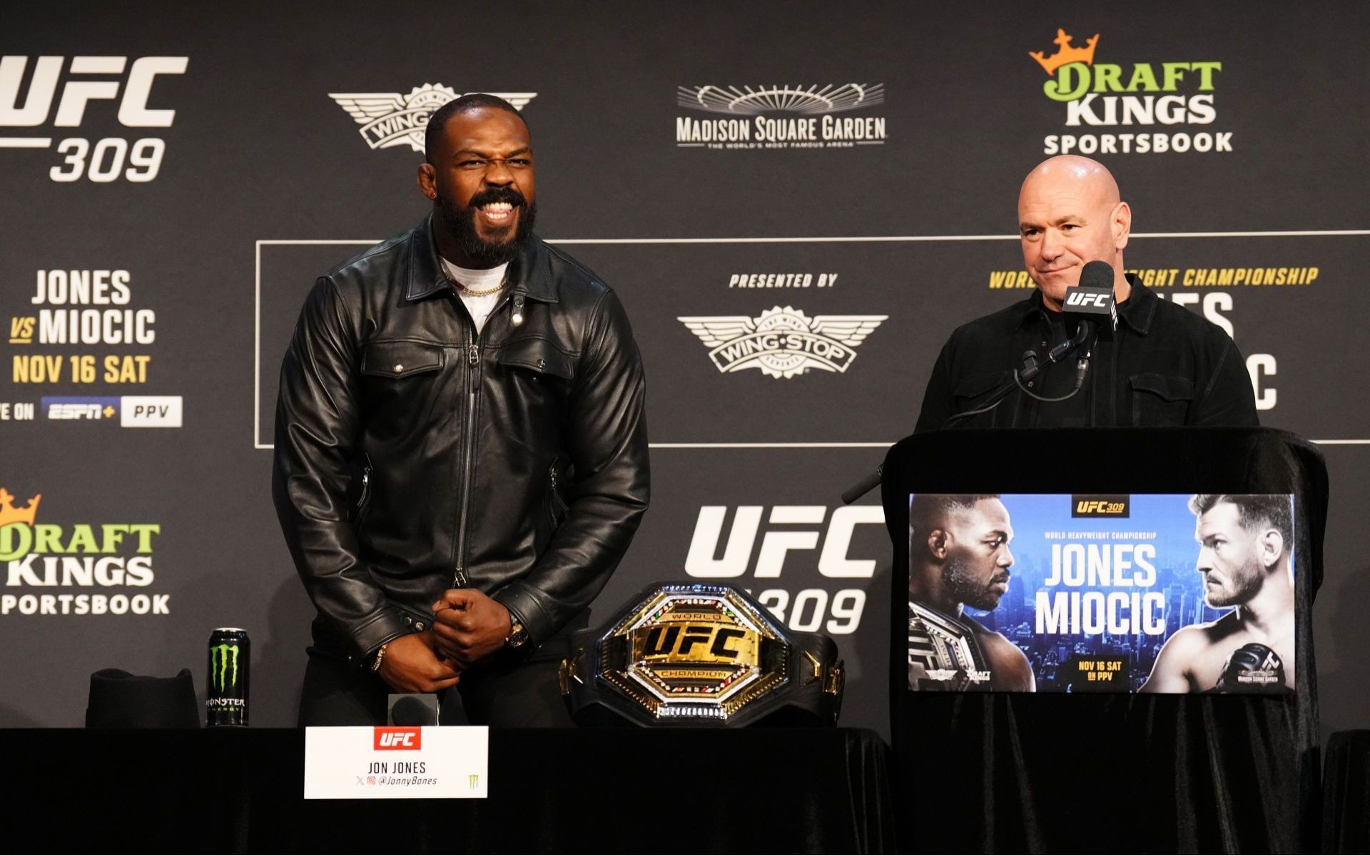 Jon Jones (left) reacts to Dana White