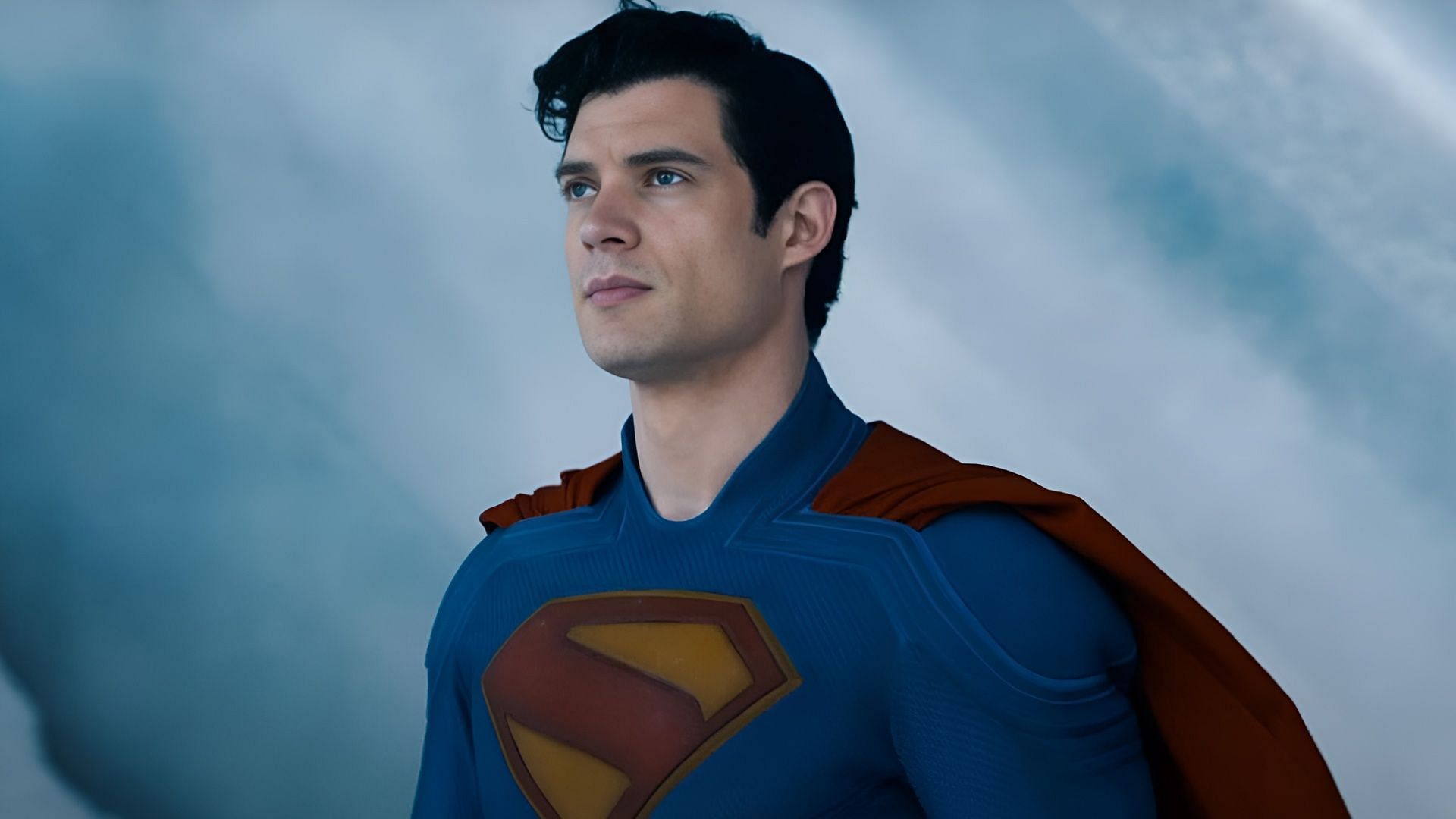 David Corenswet as Superman in red and blue costume, standing in the icy interior of the Fortress of Solitude.