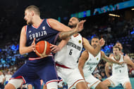Serbia power forward Nikola Jokic (15) controls the ball against Germany guard Nick Weiler-Babb - Source: Imagn