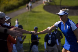 Charley Hull styles a blue jacket as she delights young fans at English golf club