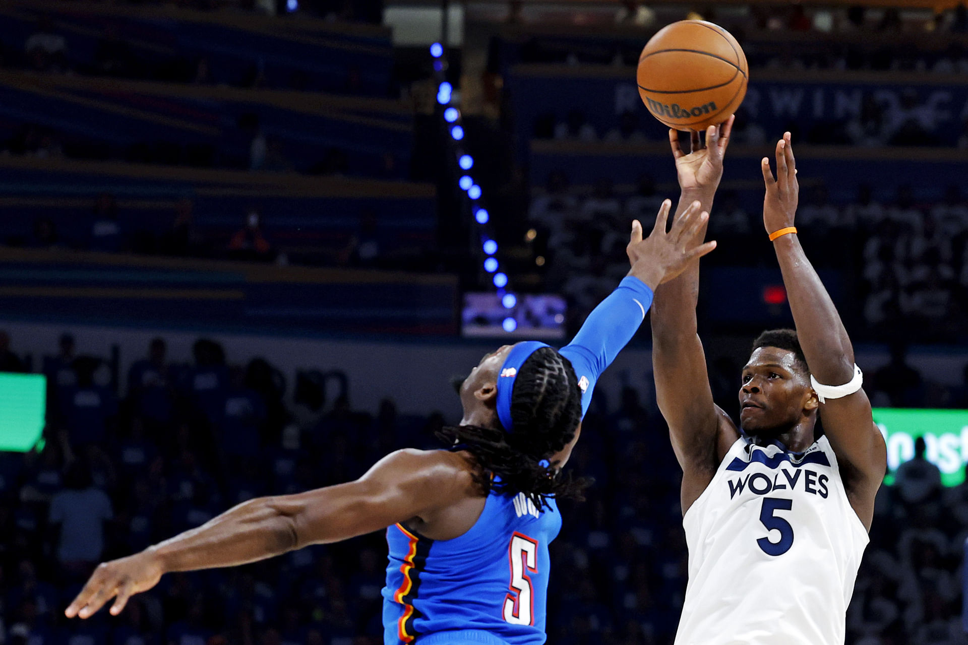 Minnesota Timberwolves guard Anthony Edwards (5) shoots the ball against Oklahoma City Thunder guard Luguentz Dort (5). (Credits: IMAGN)
