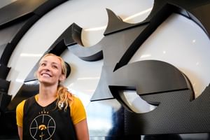 IN PIC: Iowa hooper Kylie Feuerbach smiles as she enjoys the sun in latest beachy snap