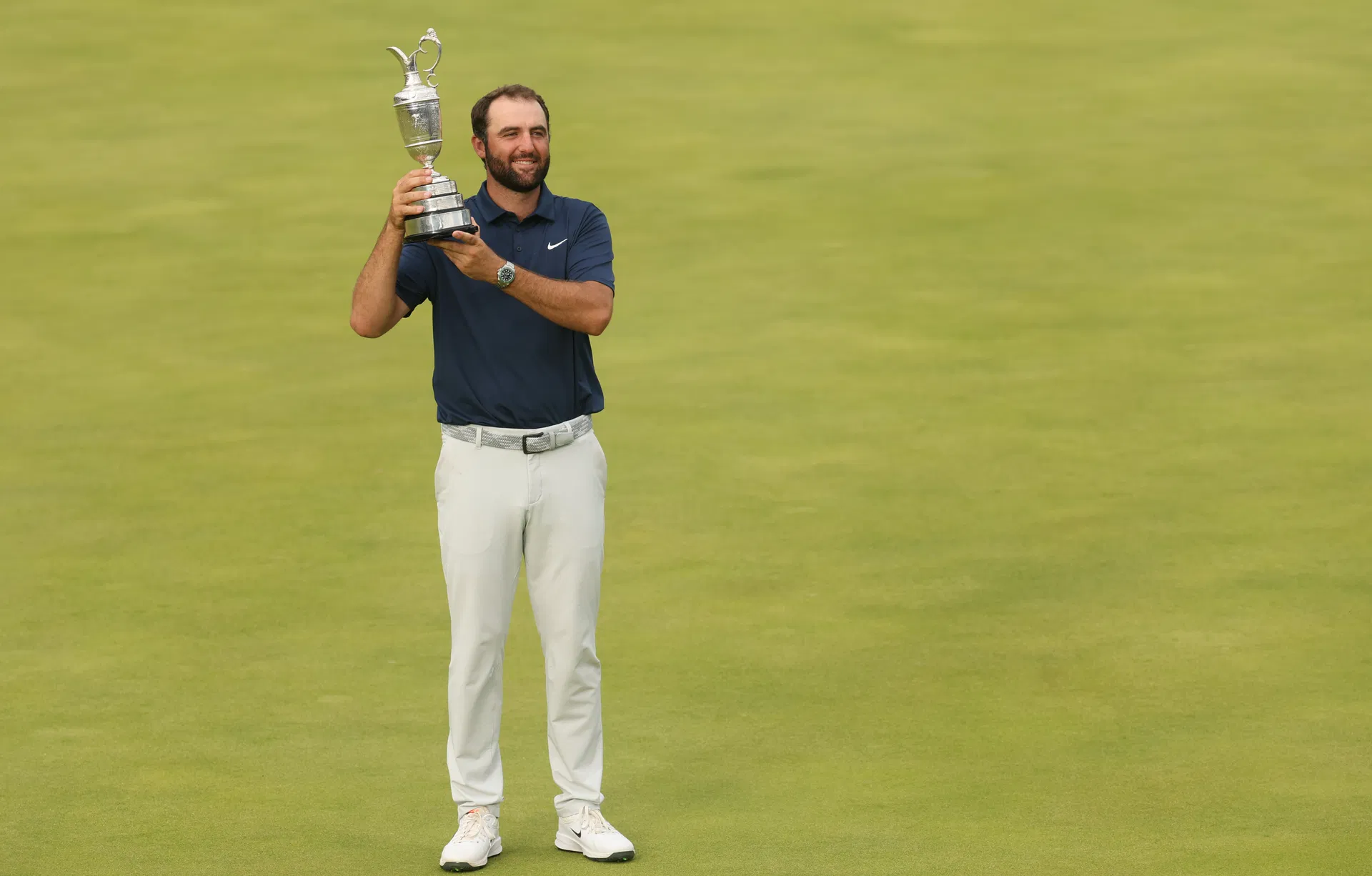 Scottie Scheffler holds up the Claret Jug at the 2025 Open Championship - Image Source: Imagn