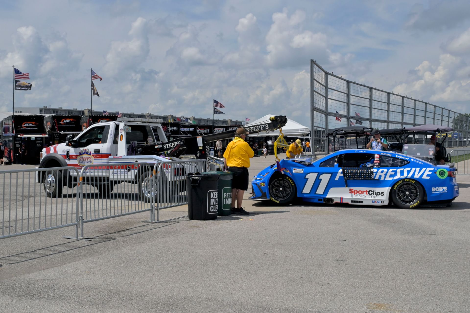 Denny Hamlin (11) is towed to the garage during the Brickyard 400 qualifying. Source: Imagn