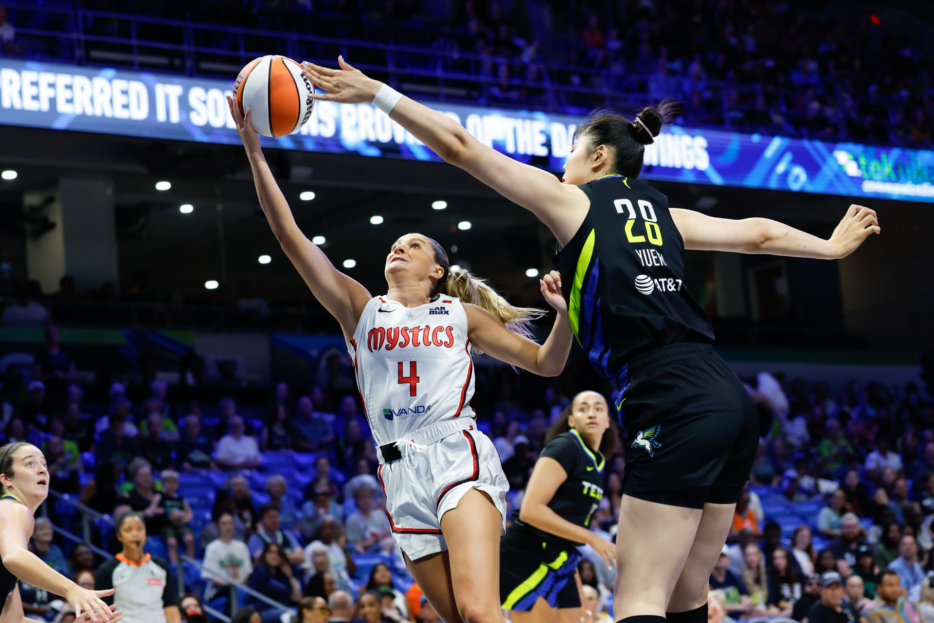Washington Mystics guard Jacy Sheldon (4) has her shot blocked by Dallas Wings center Li Yueru (28) during the first half at College Park Center. Mandatory Credit: Chris Jones (Credits: IMAGN)