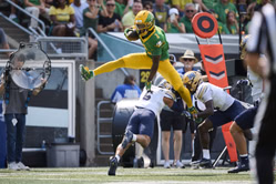 Oregon WR Dakorien Moore shares an adorable moment with his "#1biggestfan" after delivering a debut vs. Montana State