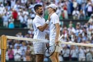 Novak Djokovic (left) and Jannik Sinner (right) embrace at the net following their semifinal clash at the 2025 Wimbledon Championships (Source: Getty)