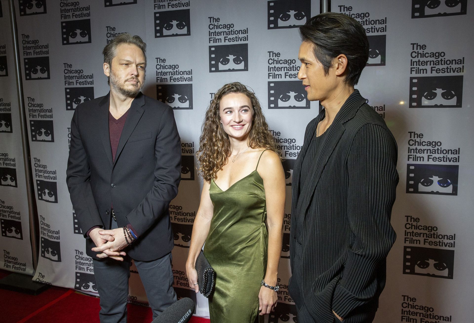 Director Jacob Gentry with actors Kelley Mack and Harry Shum Jr. on the red carpet for "Broadcast Signal Intrusion" during the 57th Chicago International Film Festival at the AMC River East Theater on October 14, 2021, in Chicago, Illinois. (Photo by Barry Brecheisen/Getty Images)