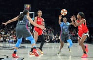 A'ja Wilson #22 of the Las Vegas Aces passes the ball to Jackie Young #0 as Brionna Jones #24 and Maya Caldwell #33 of the Atlanta Dream - Source: Getty