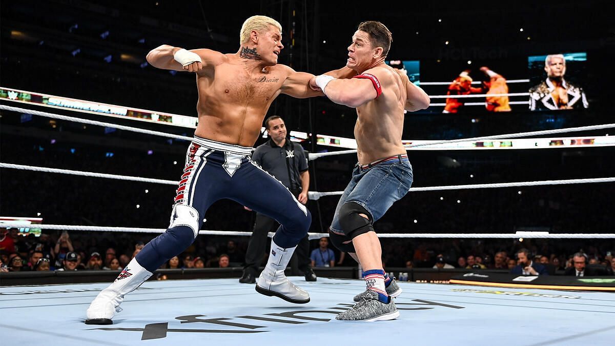 John Cena battles Cody Rhodes, both with exquisite heads of hair (Credit: WWE.com)