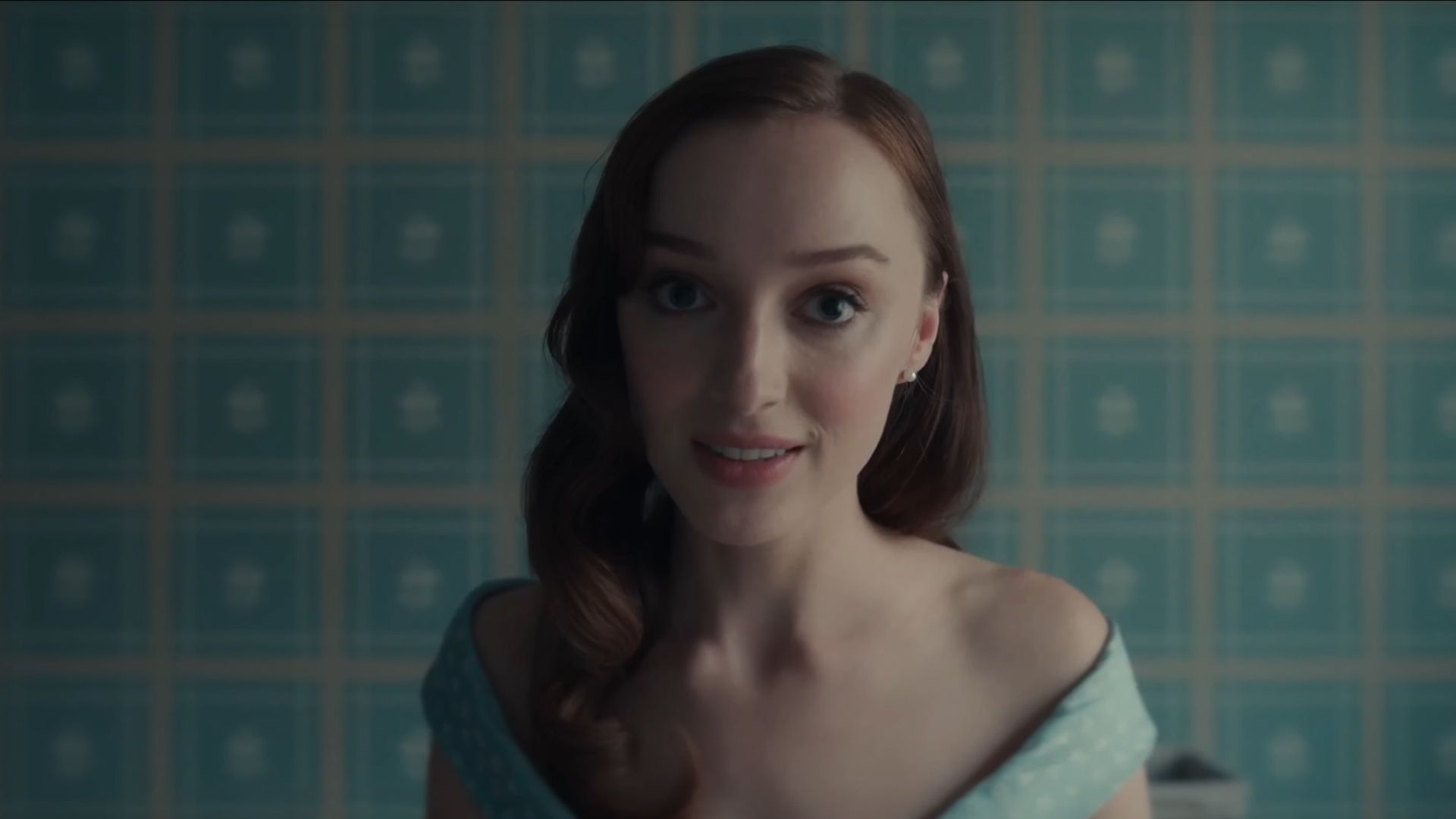 Phoebe Dynevor as Liz looks directly into the camera in a tense moment from Anniversary. (Image via Lionsgate)