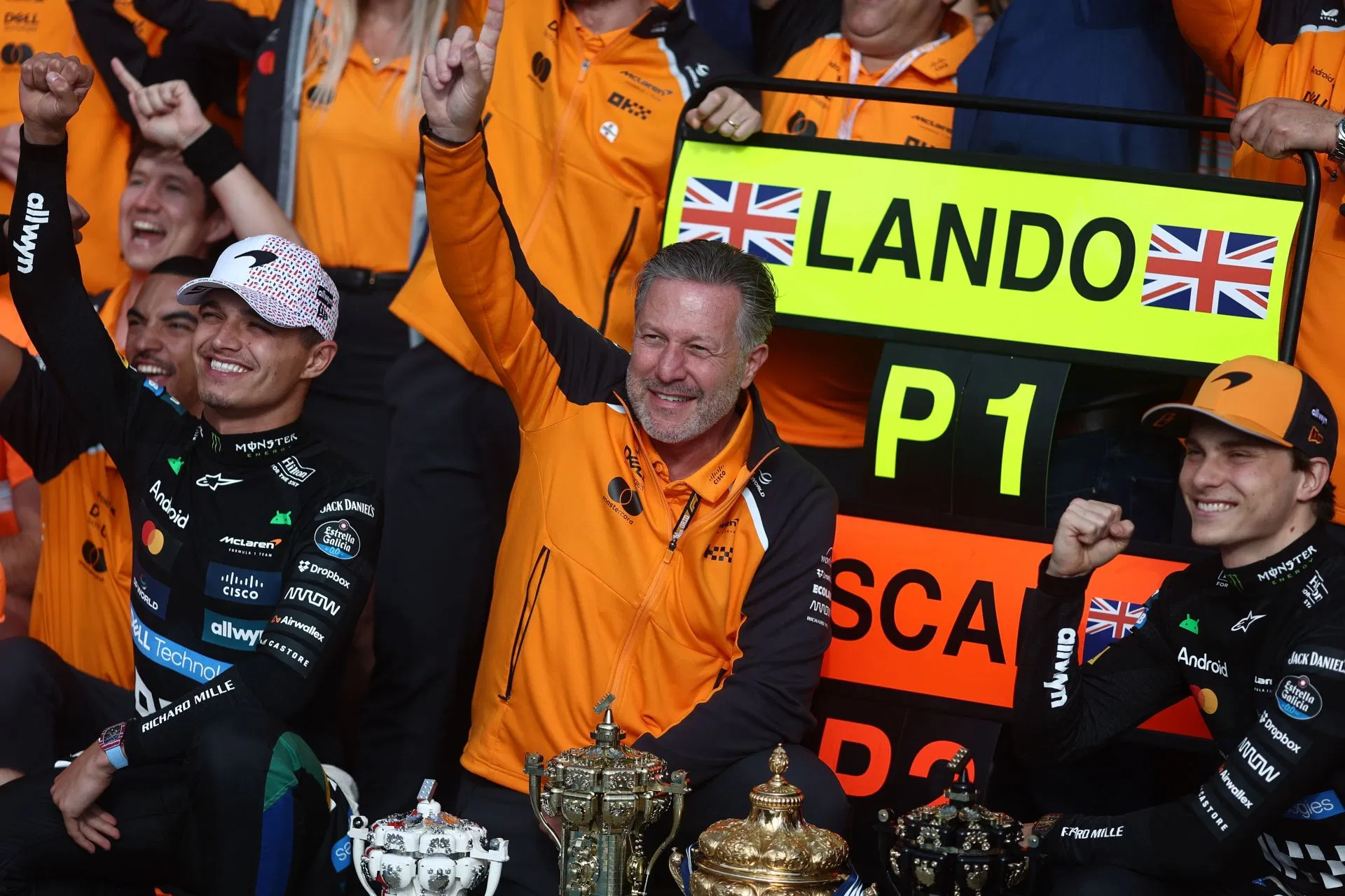 Lando Norris (L), Zak Brown, and Oscar Piastri (R) after the F1 British Grand Prix 2025 - Source: Getty