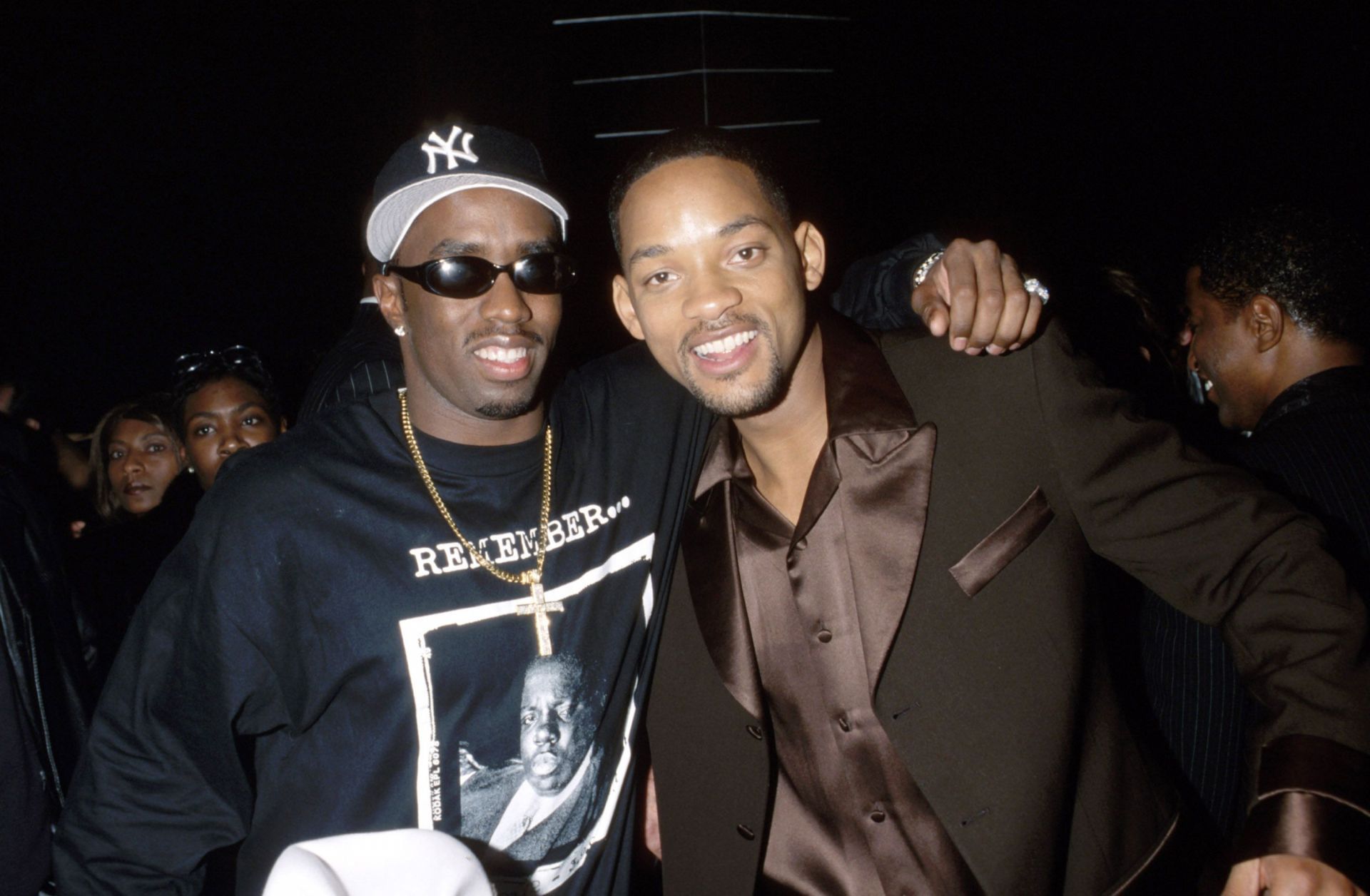 Diddy, born Sean &quot;Puffy&quot; Combs, pictured with Will Smith at the 40th Annual GRAMMY Awards (Image via Getty)