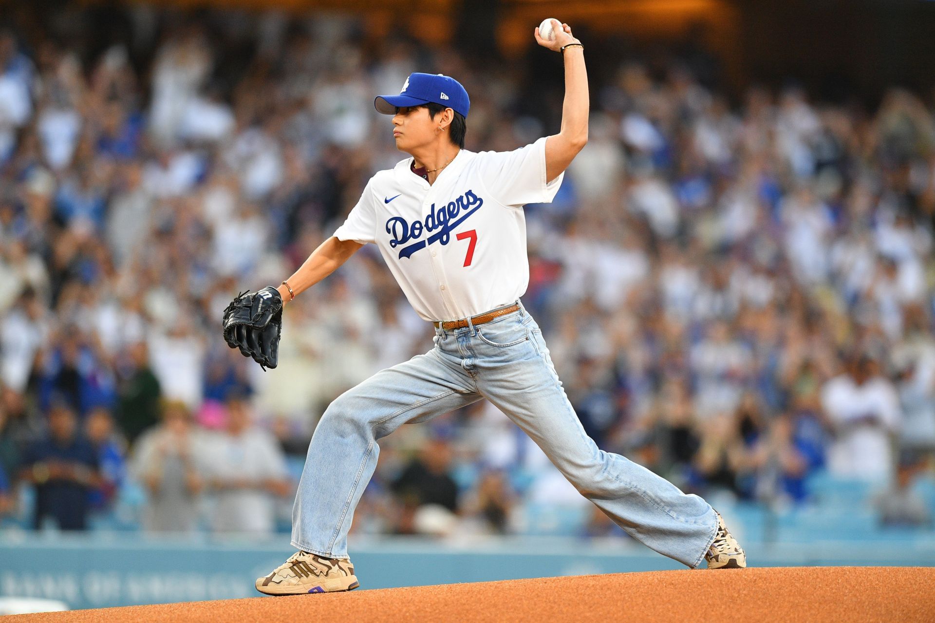 Kim Tae-Hyung, aka V of BTS, throws out the first pitch prior to the MLB game between the Cincinnati Reds and the Los Angeles Dodgers on August 25, 2025, at Dodger Stadium in Los Angeles, CA. (Photo by Brian Rothmuller/Icon Sportswire via Getty Images)