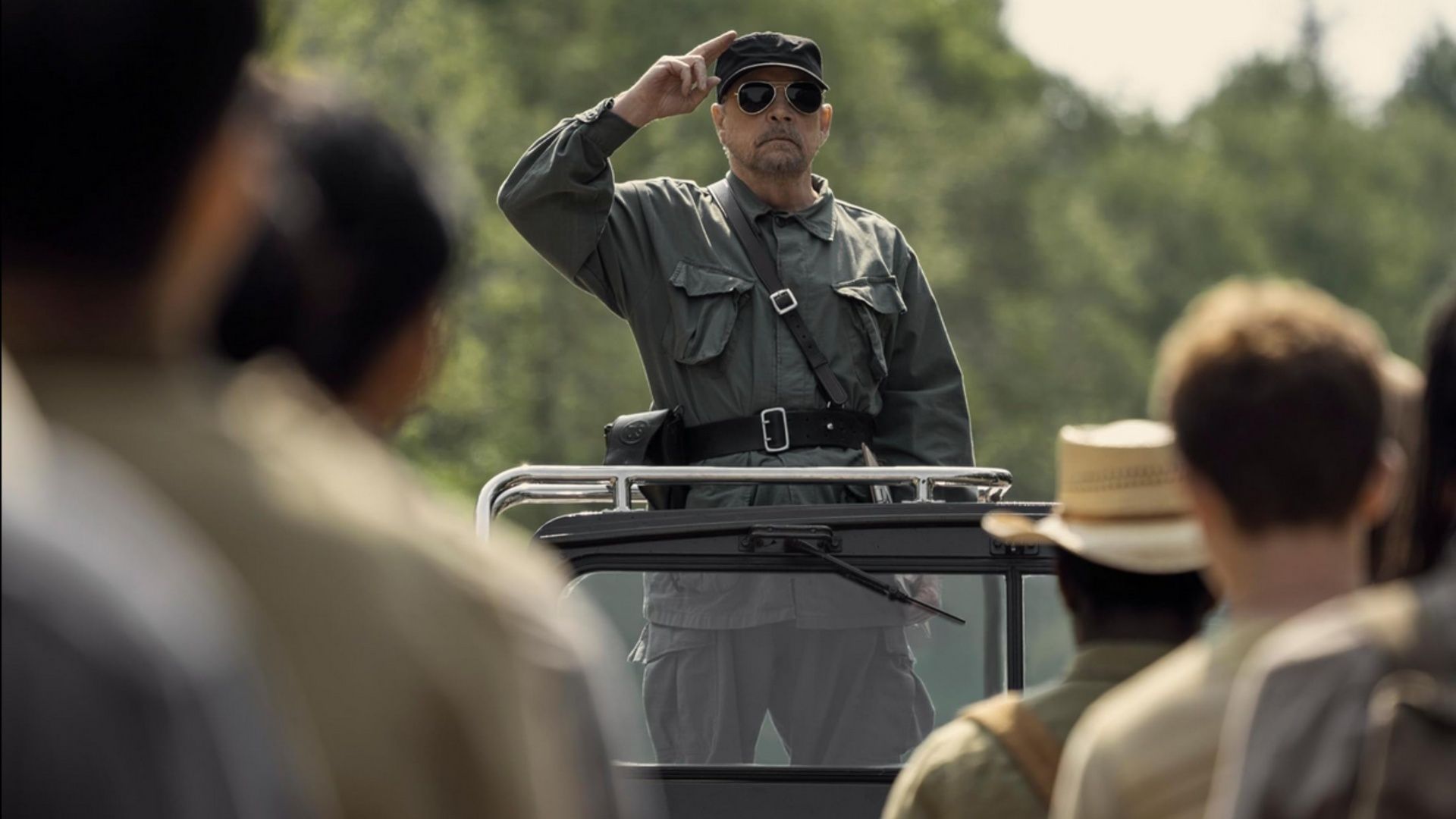 Mark Hamill as the Major leads the march in The Long Walk, symbolizing the control of the totalitarian regime. (Image via YouTube/Lionsgate Movies)