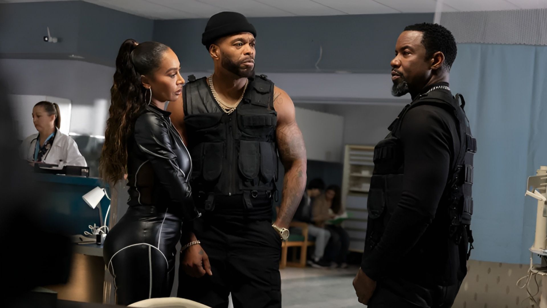 Michael Jai White, Method Man, and La La Anthony wearing tactical gear in a hospital corridor in Trouble Man (2025).