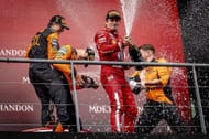 Charles Leclerc with McLaren drivers on Belgian GP podium - Source: Getty