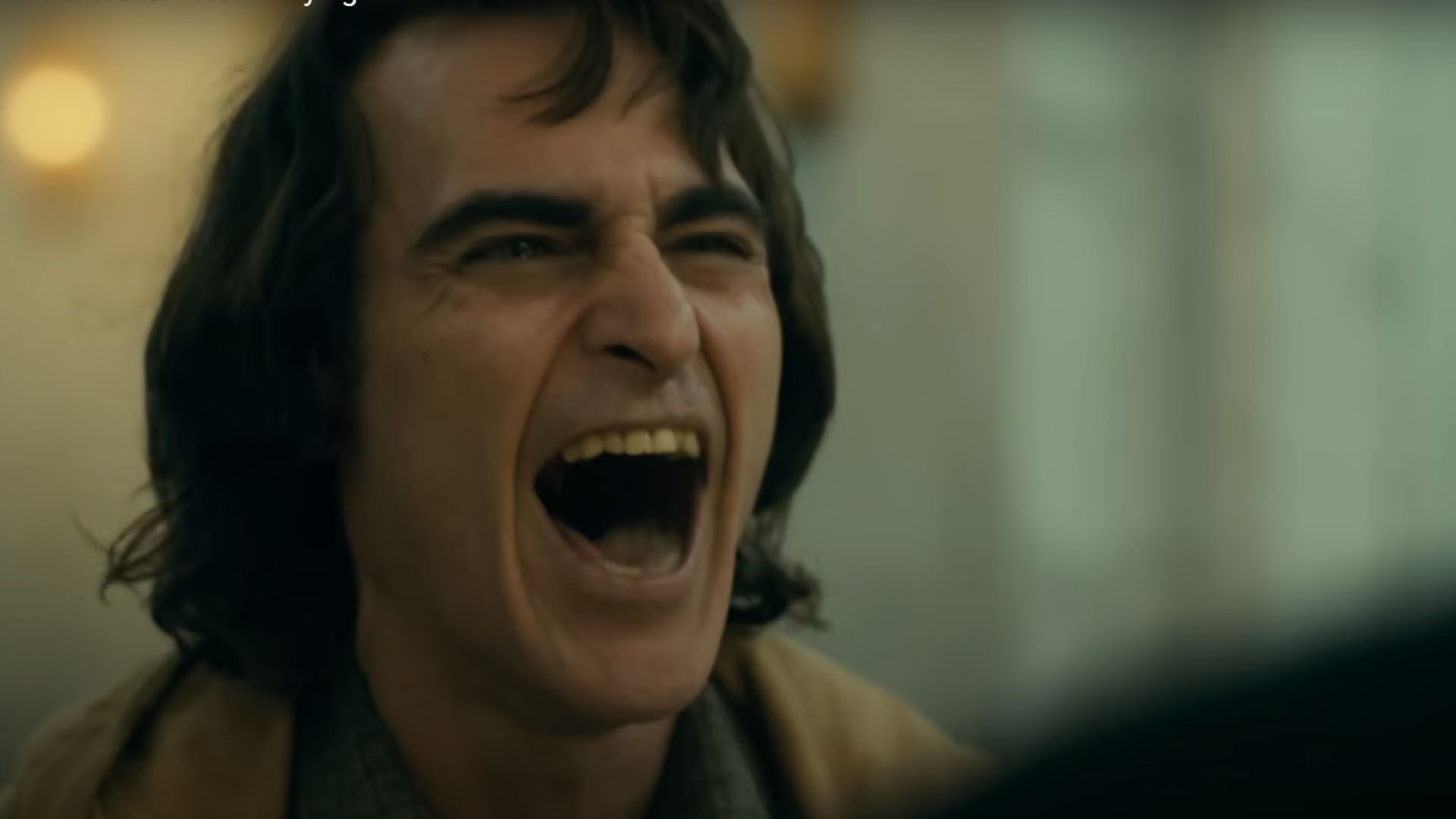 Phoenix as Joker (Image via YouTube/Warner Bros.)