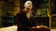 Emma Stone in Bugonia after shaving her head, embodying her intense character with a bold new look. (Image via YouTube/Focus Features)