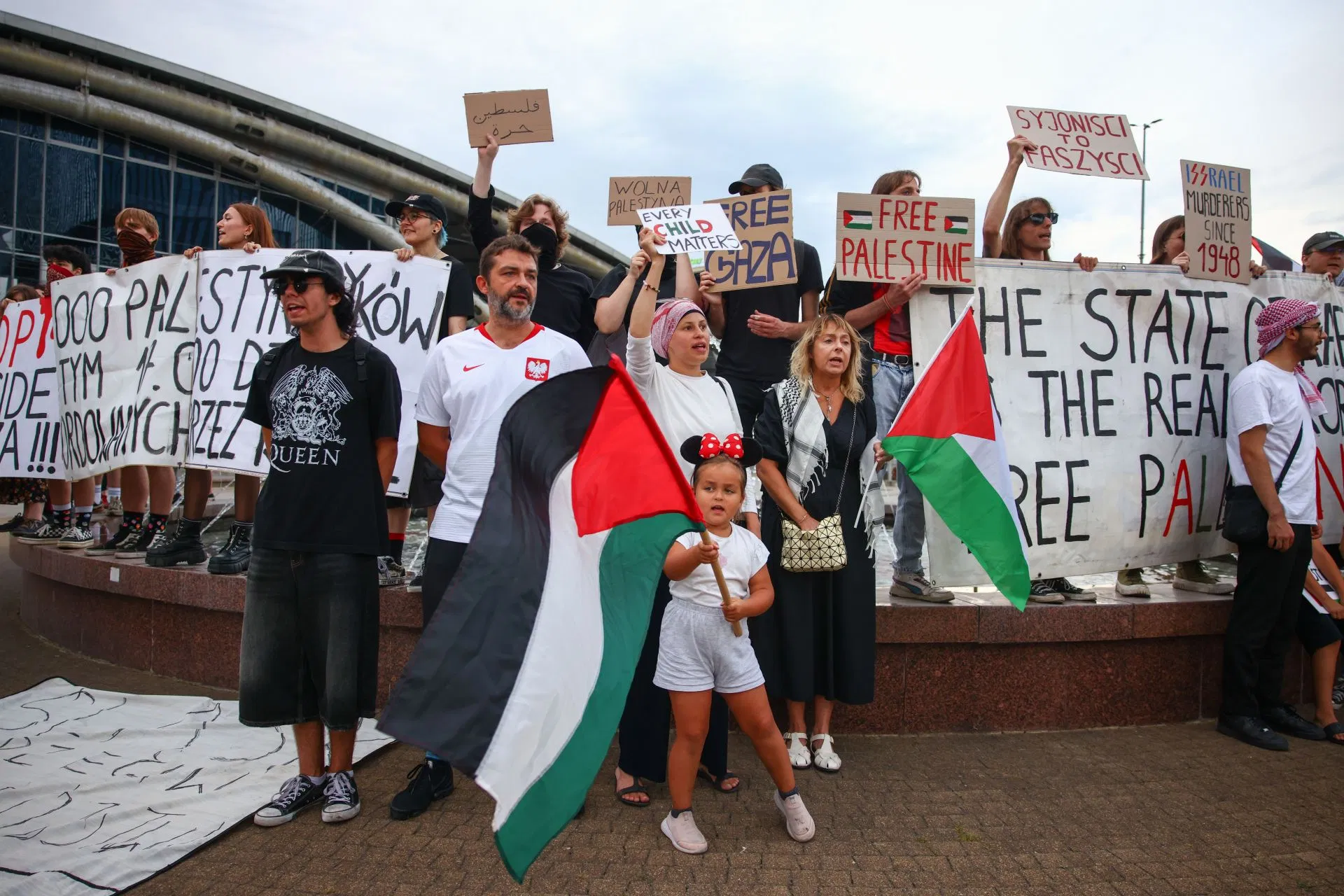 Pro-Palestine protesters hold flags and banners while demonstrating against war crimes committed in Gaza, ahead of the FIBA EuroBasket 2025 game against Poland in Katowice, Poland (Credits: Getty)