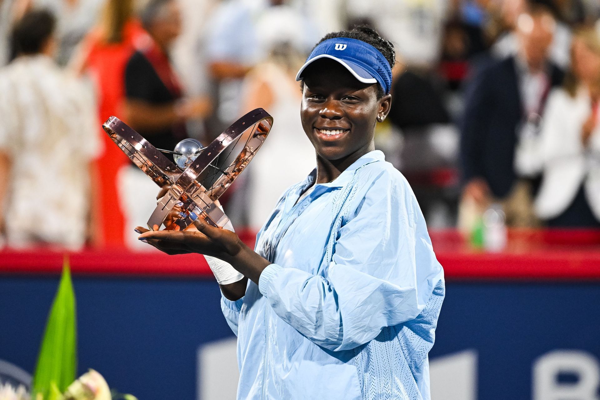 Victoria Mboko poses with the women&#039;s singles trophy at the 2025 National Bank Open in Montreal (Source: Getty)