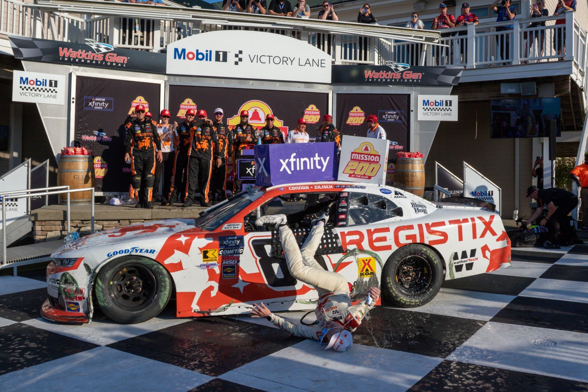 Connor Zilisch (#88 JR Motorsports Registix Chevrolet) falls from his Registix Chevrolet and hits his head on landing in Victory lane At The Glen on August 09, 2025, at Watkins Glen International in Watkins Glen,- Source: Getty