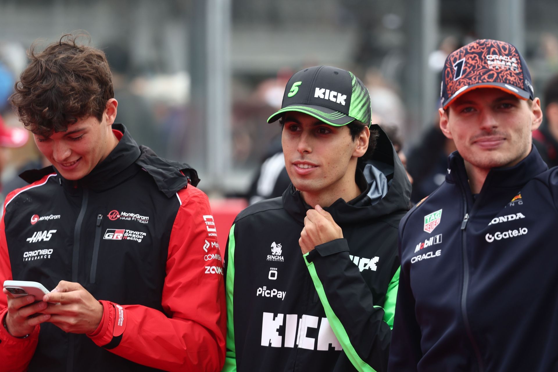 Oliver Bearman, Gabriel Bortolet, and Max Verstappen at the 2025 F1 Belgian Grand Prix - Source: Getty