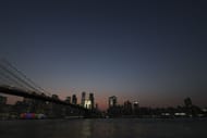 A general view of the skyline of lower Manhattan and the Brooklyn Bridge in Brooklyn, New York (Image via Getty)