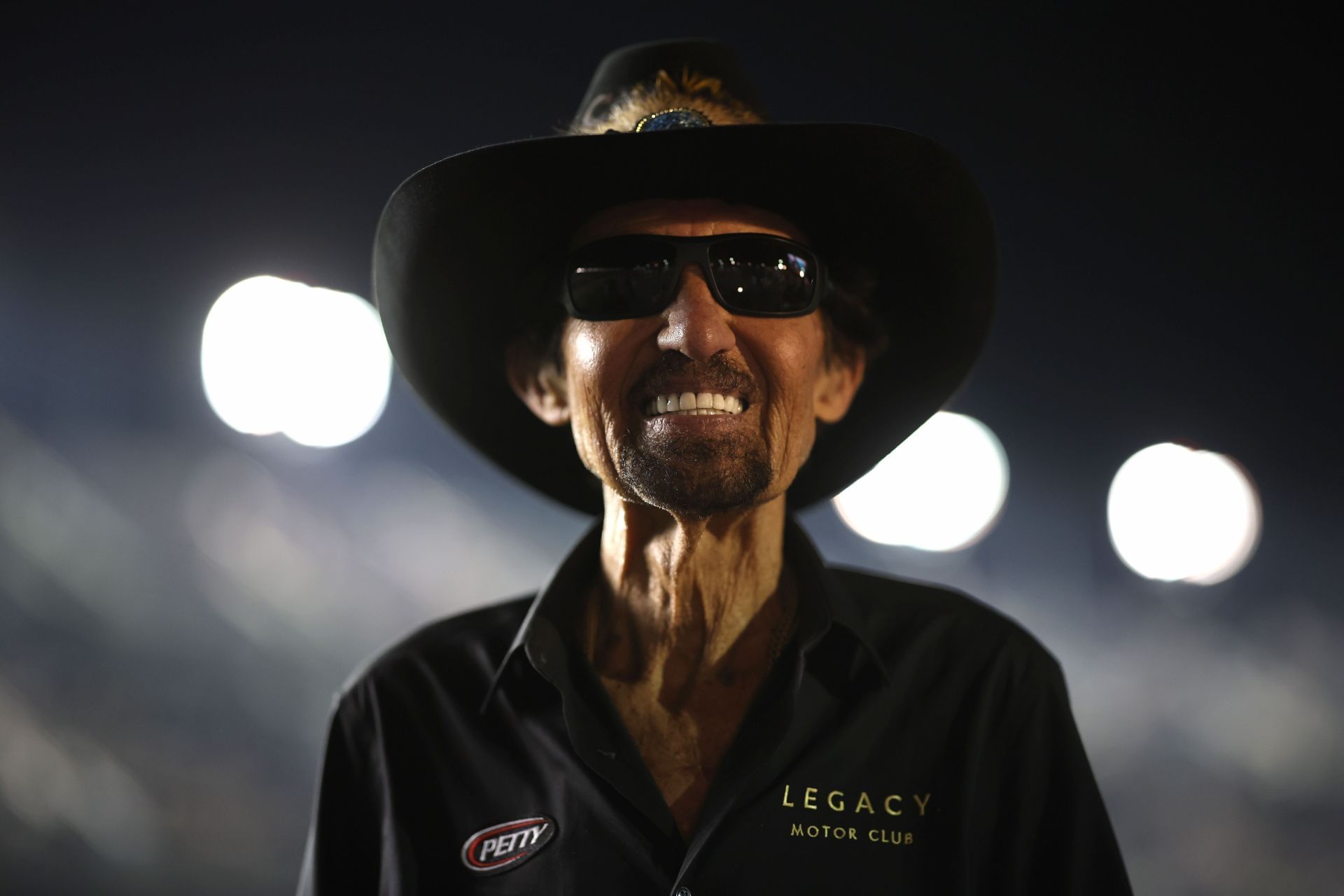 NASCAR Hall of Famer and team owner Richard Petty walks the grid the NASCAR Craftsman Truck Series NextEra Energy 250 - Source: Getty