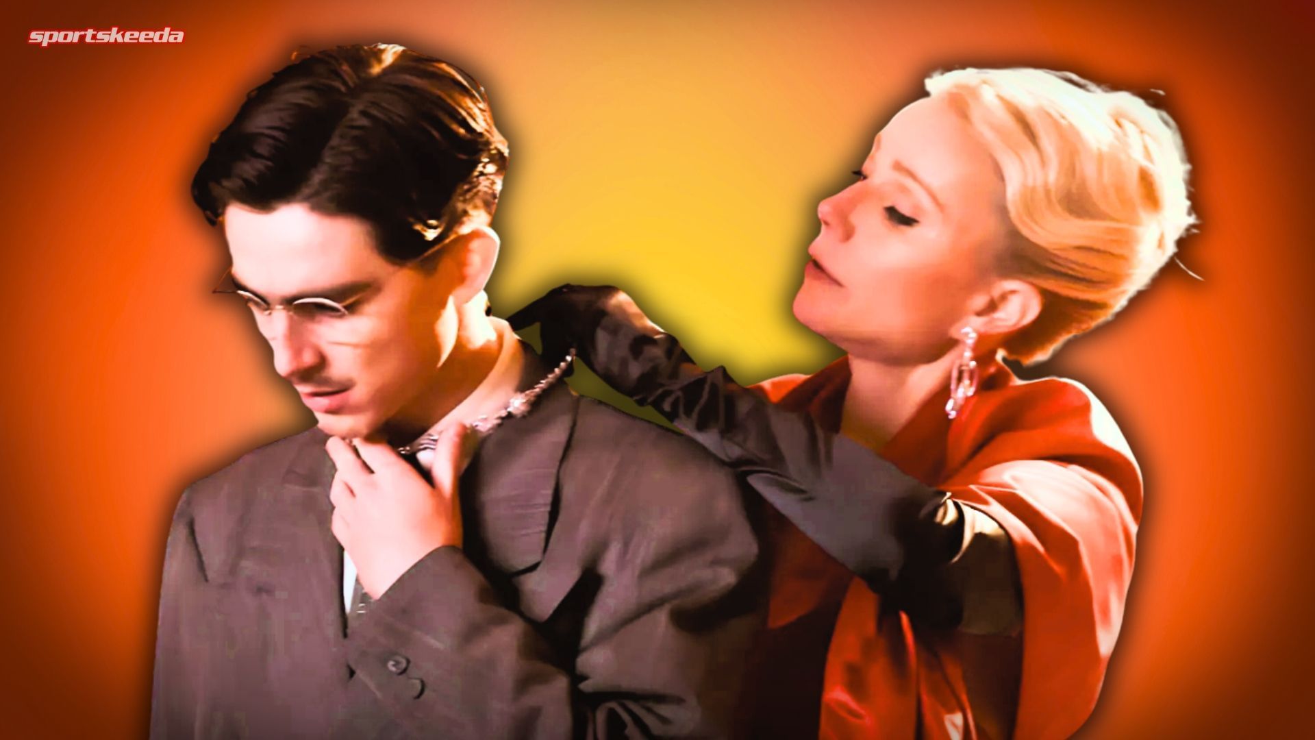  Gwyneth Paltrow adjusting a necklace around Timoth&eacute;e Chalamet&rsquo;s neck in a scene from Marty Supreme.