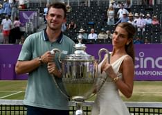 Tommy Paul has an adoring reaction to fiancée Paige Lorenze's chic look as she channels inner businesswoman
