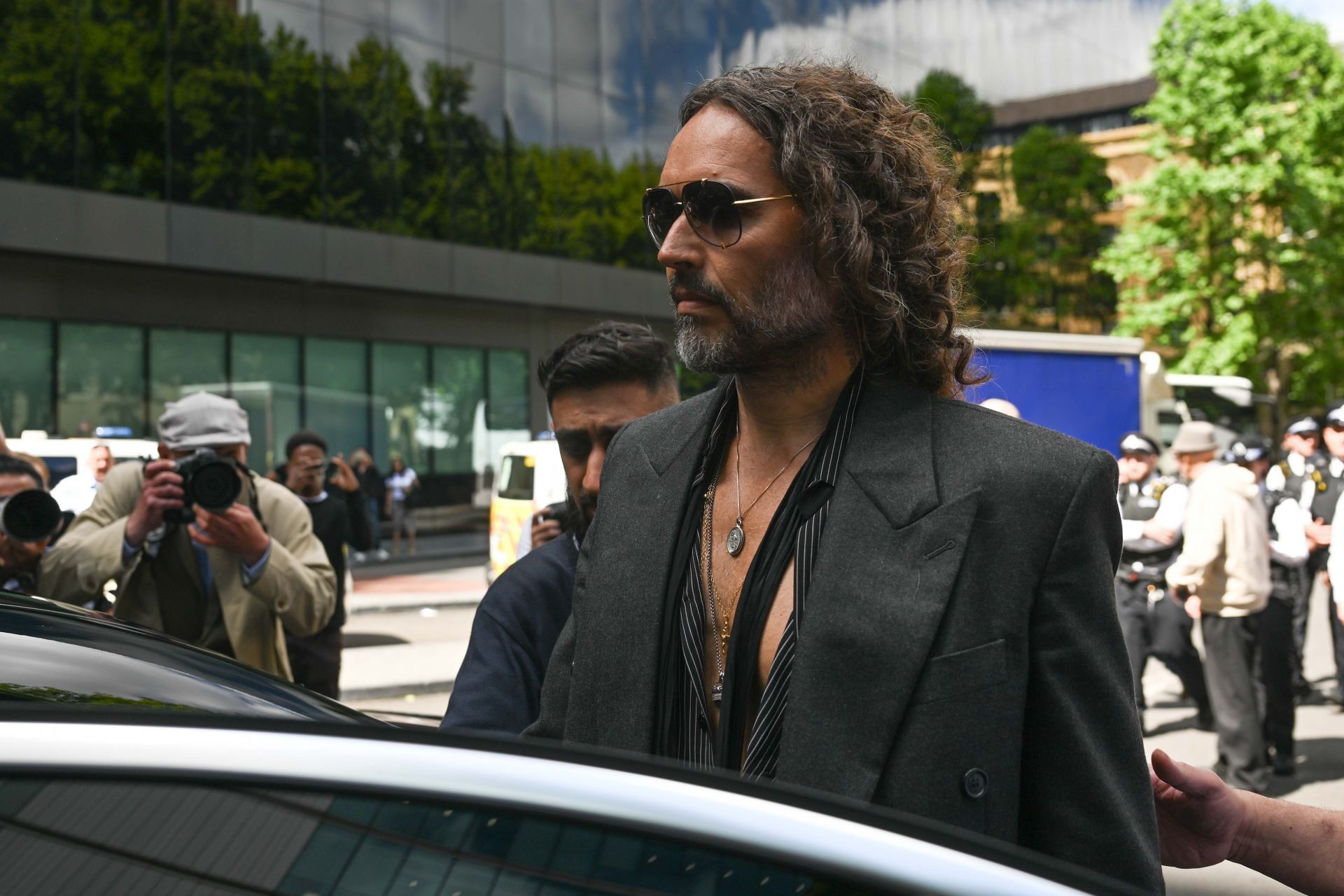 Russel Brand appears at court in London on rape and assault charges - Source: Getty
