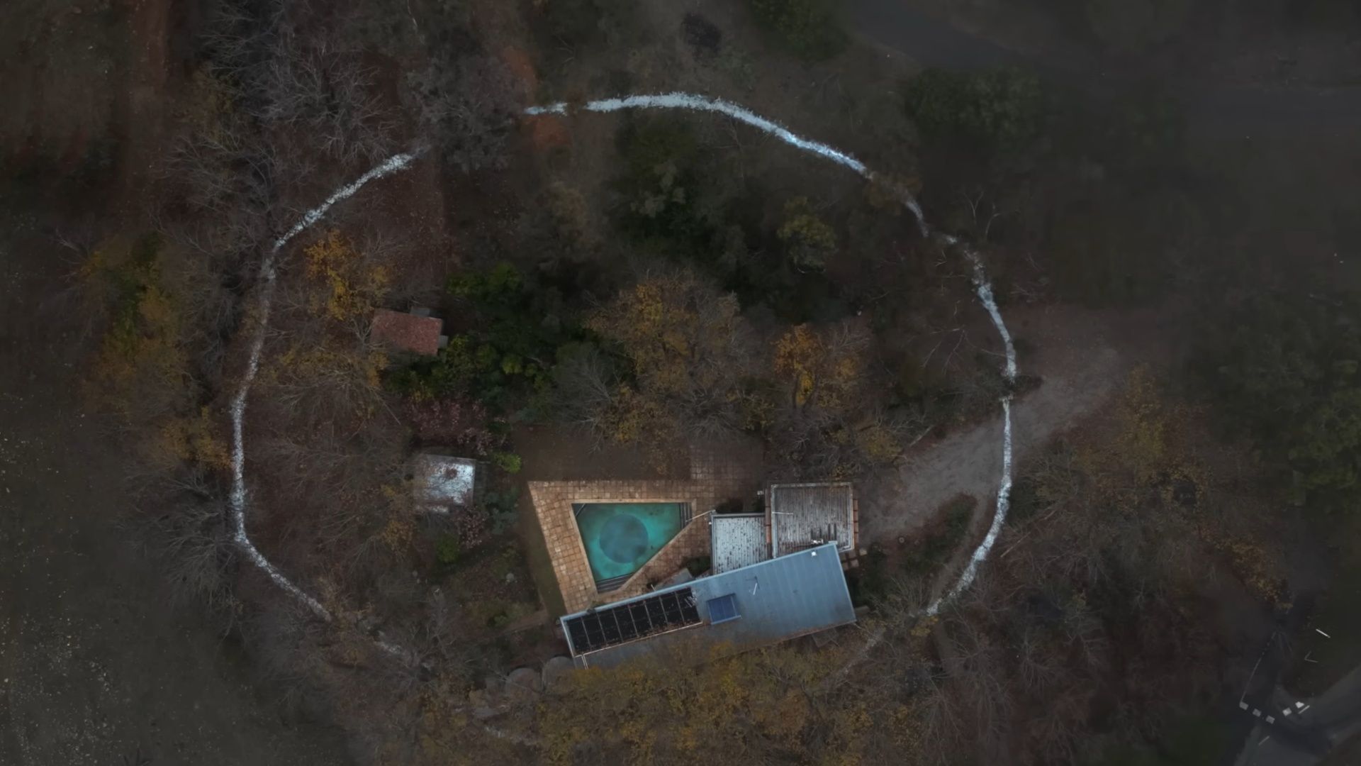 The white-painted circle around the house in Bring Her Back serves as both a supernatural barrier and a symbol of Laura&#039;s need for control. (Image via A24)