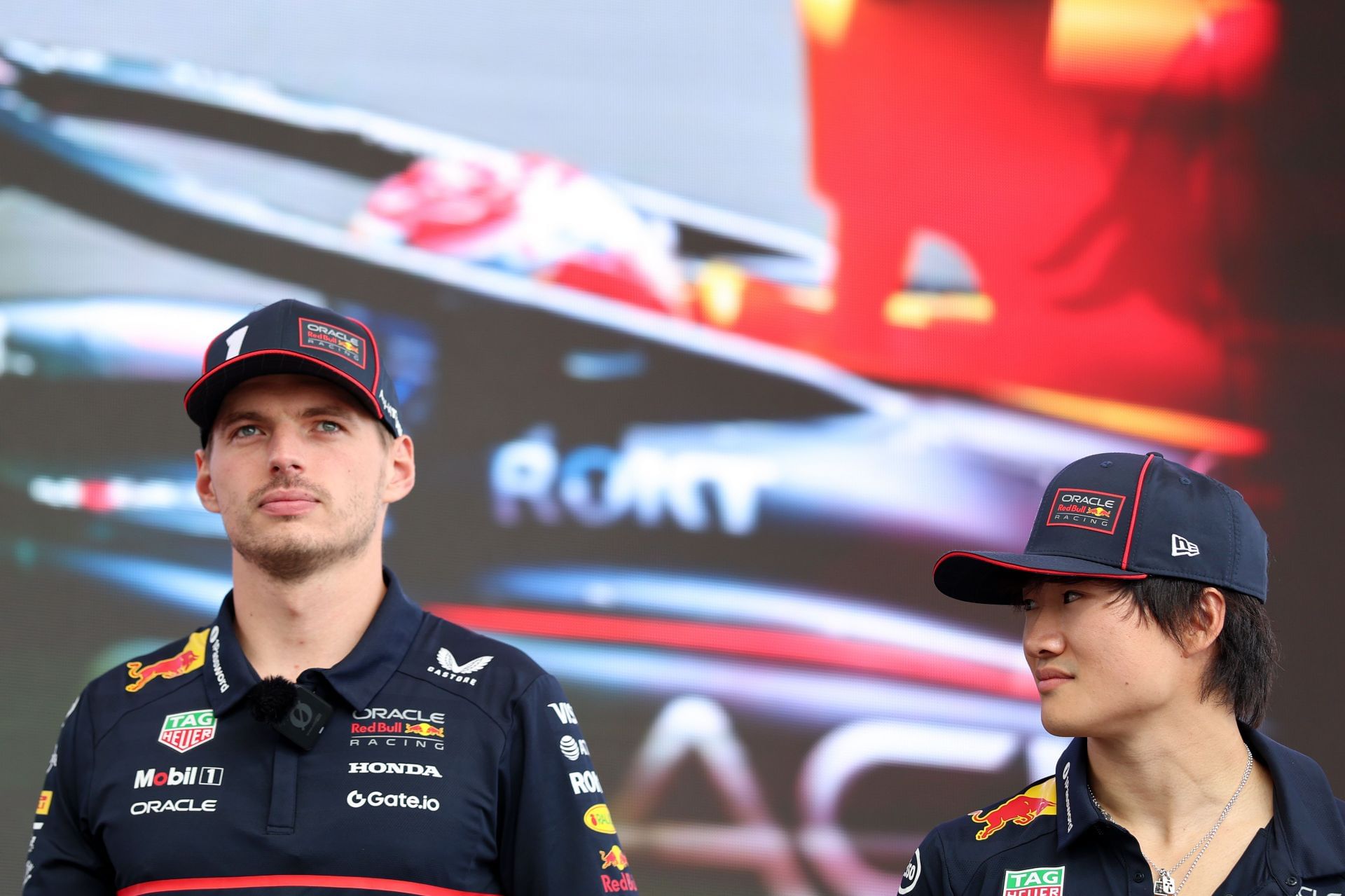 Red Bull&#039;s Max Verstappen (L) and Yuki Tsunoda (R) at the 2025 F1 Grand Prix of Hungary race weekend - Source: Getty