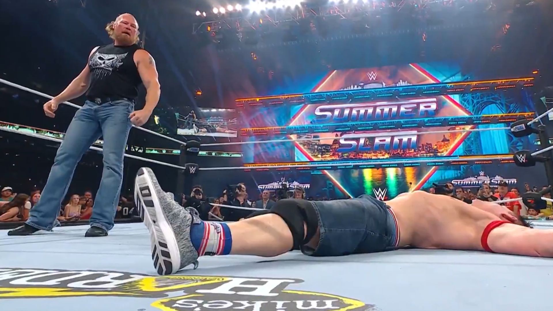 Brock Lesnar looking down at John Cena [Image Credits: WWE