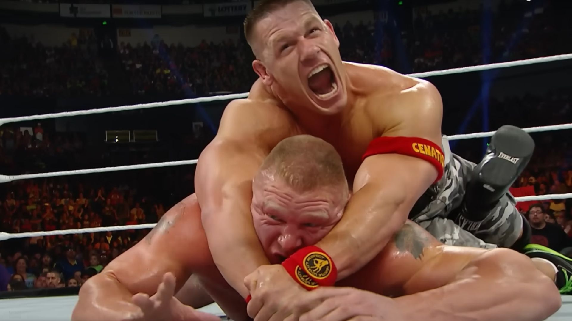 John Cena with an STF submission hold on Brock Lesnar [Image Credits: WWE