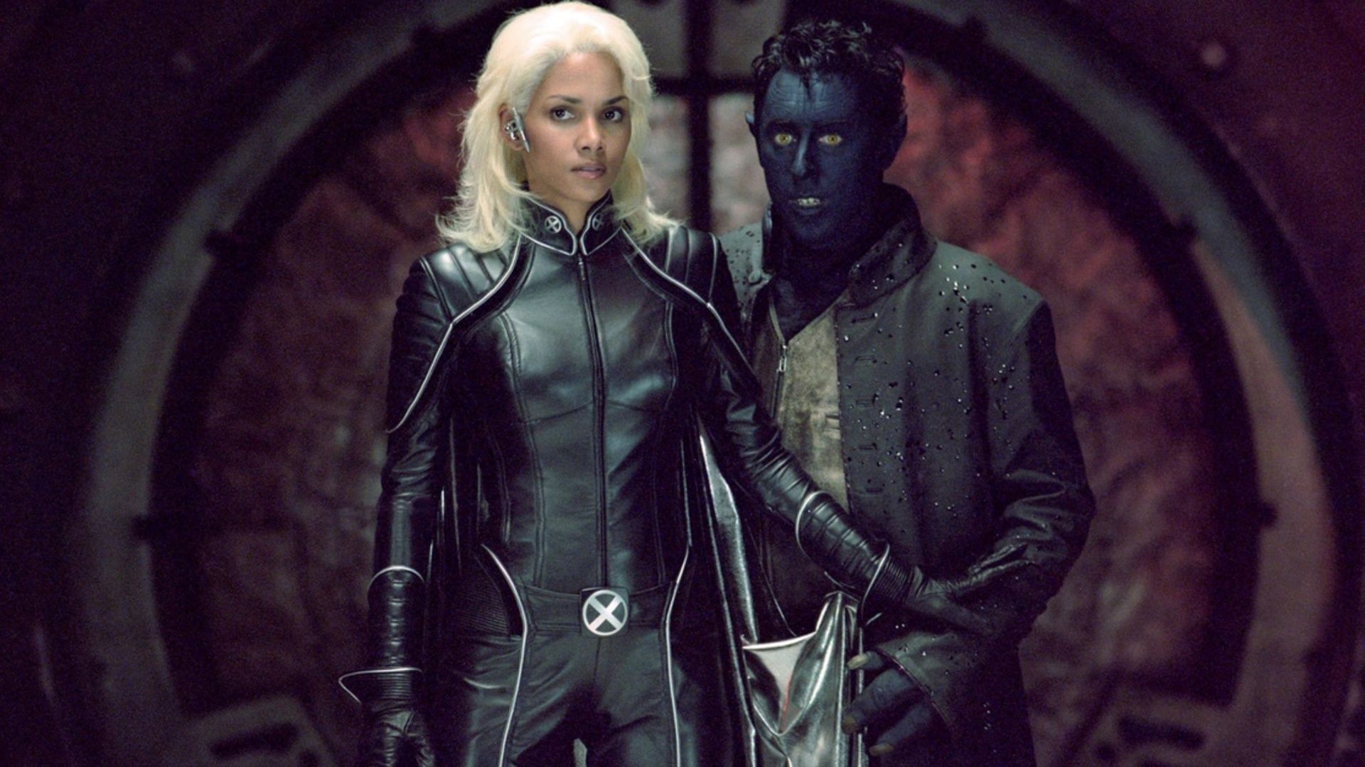 Halle Berry as Storm stands beside Alan Cumming as Nightcrawler in a scene from X2: X-Men United (Image via Disney+)